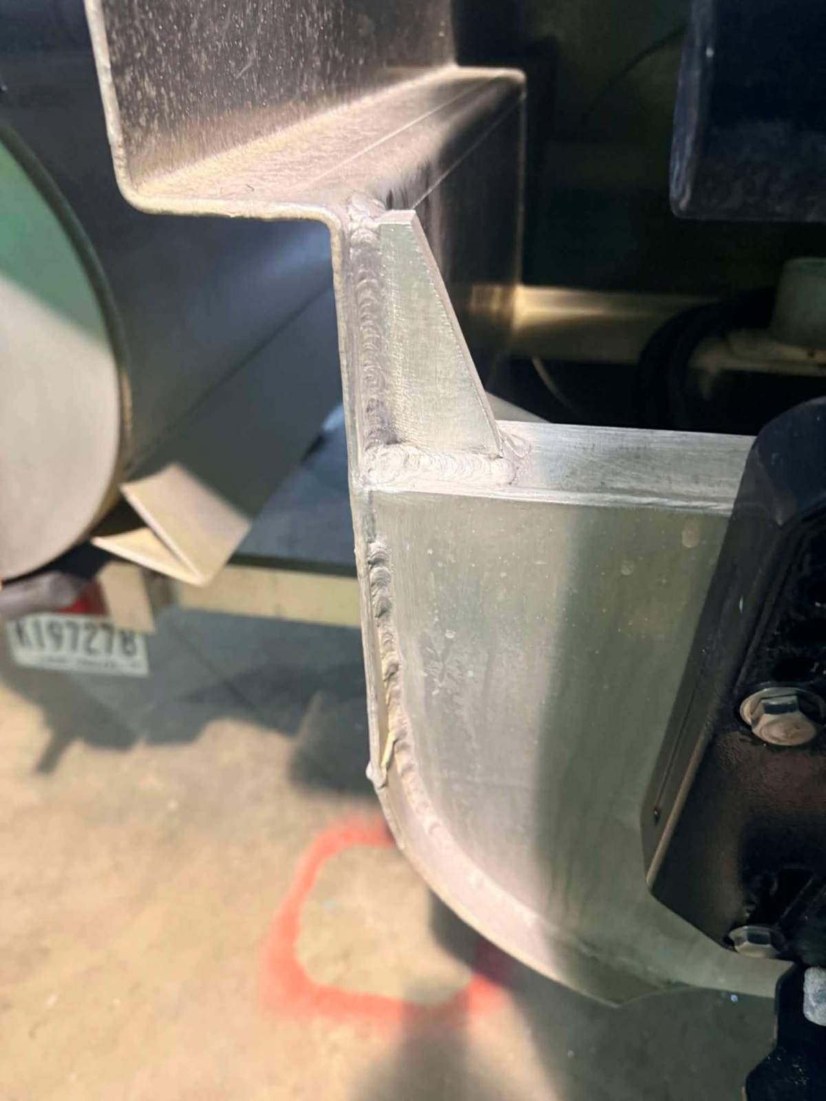 Aluminum fender brace welded to a custom trailer frame in Bunkie, Louisiana